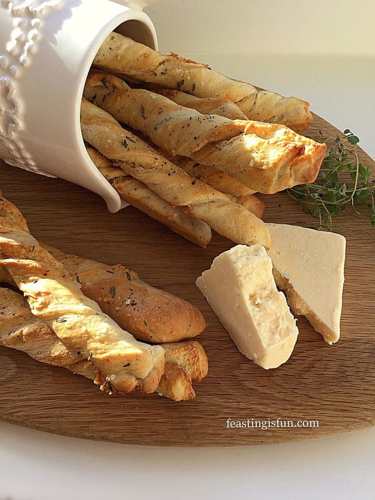 Stack of fresh Italian bread sticks in a basket