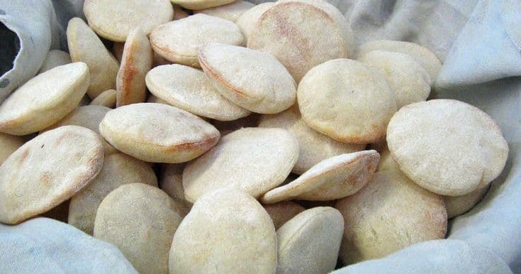 Stack of fresh mini pita breads in a bowl